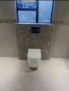 WE SPECIALIZE IN BATHROOMS RENOVATIONS TILERS PLUMBERS PAINTERS CARPENTER HANDYMAN WATERPROOFING