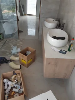 WE SPECIALIZE IN BATHROOMS RENOVATIONS TILERS PLUMBERS PAINTERS CARPENTER HANDYMAN WATERPROOFING