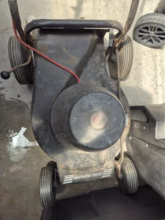 LAWN MOWER AND A TRIMMER