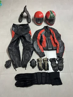 Two piece leather suit, gloves; helmets, kidney belt, boots.