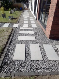 NEGOTIABLE TREE FELLING SERVICE AND GARDEN STONES DECORATION