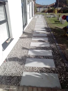 NEGOTIABLE TREE FELLING SERVICE AND GARDEN STONES DECORATION