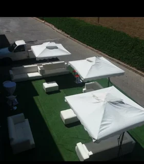 Outdoor furniture hire. Lounge couches mix with cocktails. Full decor set up, glass tables hire.