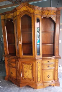 Antique Mahogany and Walnut curved display cabinet. In very good condition