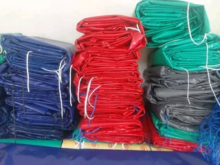 PROTECTIVE TARPAULINS,CARGO NETS &amp; CORNER PLATES AVAILABLE