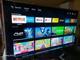 HISENSE 65 INCH WITH MI BOX S AND STAND AND REMOTES