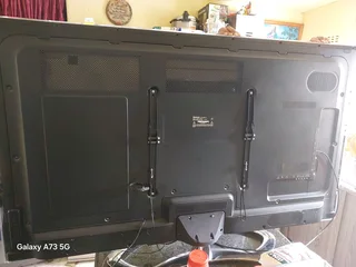 HISENSE 65 INCH WITH MI BOX S AND STAND AND REMOTES