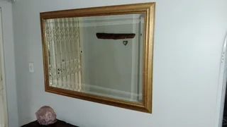 Classic gold framed wall mirror.