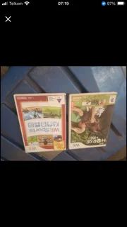 Wii in original box with 3 games and accesories