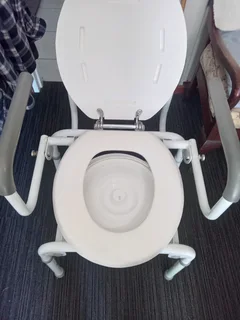 Commode drop arm