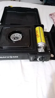 Gas stove portable in excellent condition.  R165, with new full canister