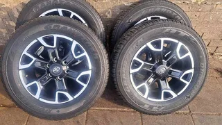A set of 18 inch legend 50 mags and tyres.   rims are like new