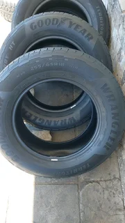 A set of 255/65/18 Goodyear wrangler.  90% thread life