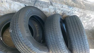 A set of 255/65/18 Goodyear wrangler.  90% thread life