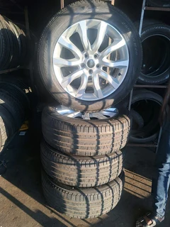 A set of Land Rover mags and 255/55R20 tires. leave your whatsapp number if interested.
