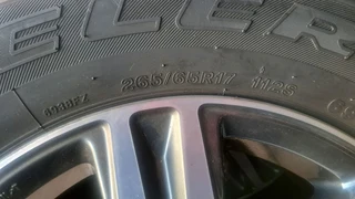265/65R17 Toyota mags and bridgestone tires, leave your whatsapp number if interested.