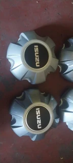 black/silver Isuzu D-max center caps available. Leave your whatsapp number if interested.