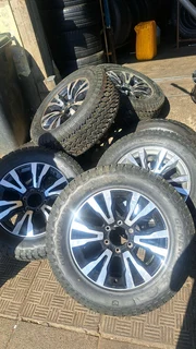 18 inch Silver &amp; Black Isuzu mags with tires.Leave your whatsapp number if interested.