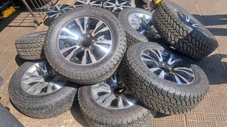 18 inch Silver &amp; Black Isuzu mags with tires.Leave your whatsapp number if interested.
