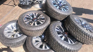 18 inch Silver &amp; Black Isuzu mags with tires.Leave your whatsapp number if interested.