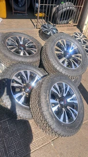 18 inch Silver &amp; Black Isuzu mags with tires.Leave your whatsapp number if interested.