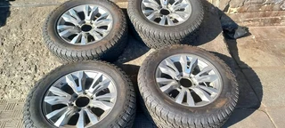 18 inch Silver &amp; Black Isuzu mags with tires.Leave your whatsapp number if interested.