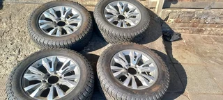 18 inch Silver &amp; Black Isuzu mags with tires.Leave your whatsapp number if interested.