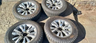 18 inch Silver &amp; Black Isuzu mags with tires.Leave your whatsapp number if interested.