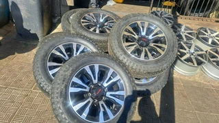 18 inch Silver & Black Isuzu mags with tires.Leave your whatsapp number if interested.
