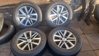 Toyota Dakar, Gd6, Fortuner mags &amp; Dunlop tires. Leave your whatsapp number if interested.