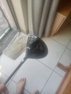 Golf club and cricket shoes