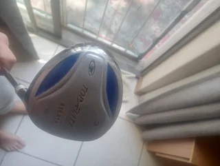 Golf club and cricket shoes