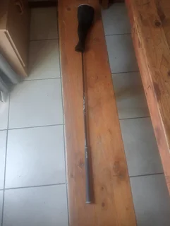 Golf club and cricket shoes