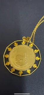 1970kruger  22 carat coin and 20 carat chain and Kruger / pendant casing. Total weight 52 grams.