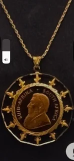 1970kruger  22 carat coin and 20 carat chain and Kruger / pendant casing. Total weight 52 grams.