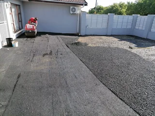 TAR ROAD AND ASPHALT DRIVEWAY
