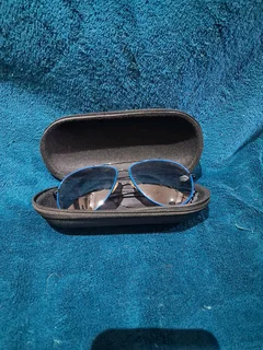 Blue rimmed aviator sunglasses and case