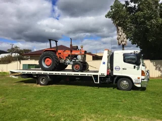 Tractor transport is our business 24/7--local/over border