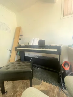 Roland electric piano + free  leather   piano chair
