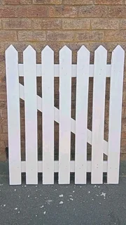Clean white picket fencing
