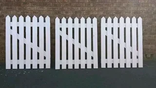 Clean white picket fencing