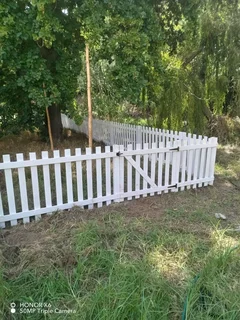 Clean white picket fencing