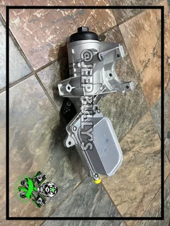 2.8 Jeep Wrangler Oil Cooler With Housing For Sale.
