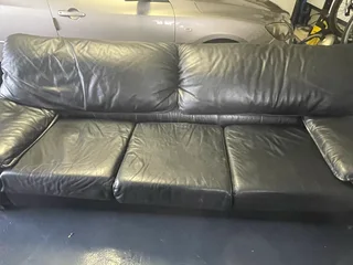 Black leather lounge suite