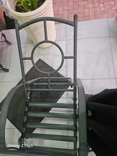 8pc outdoor glass top metal patio set.