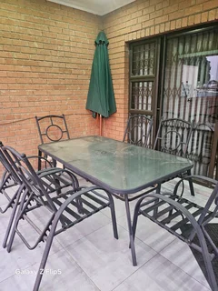 8pc outdoor glass top metal patio set.