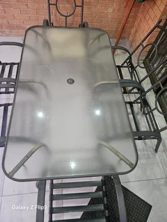 8pc outdoor glass top metal patio set.