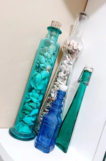 Vintage antique glass bottles shells colourful decor display