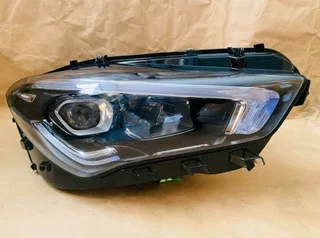 Mercedes-Benz CLA W118 model, specifically a replacement lens or the entire headlight assembly.