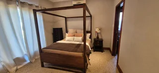 Antique four post bed with bedside table and chest of drawers